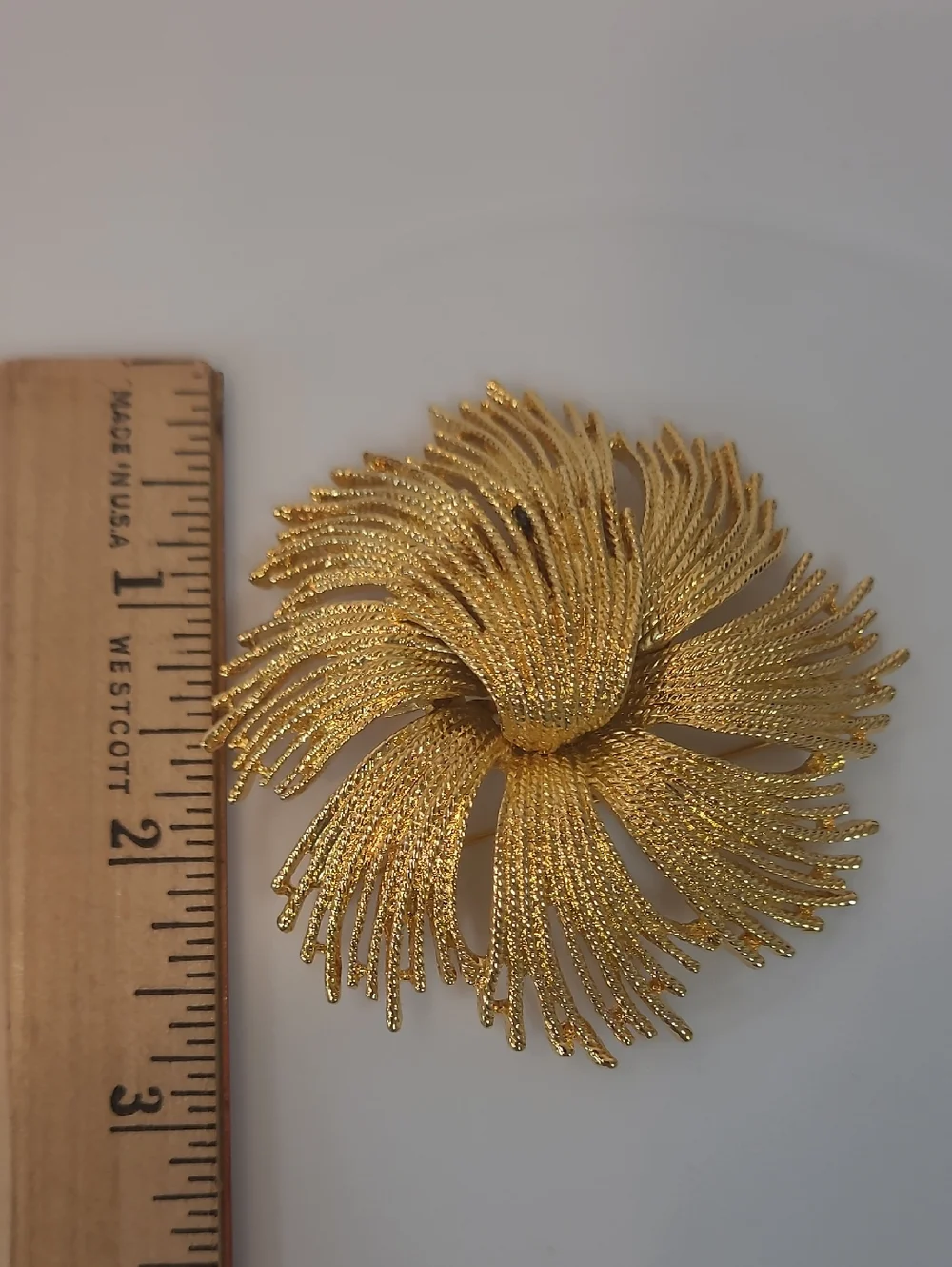 Monet Vintage Cordelia Gold Tone Starburst Brooch with Textured Metal Threads